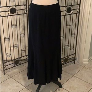 Midi-length lined black skirt with gore detailing.